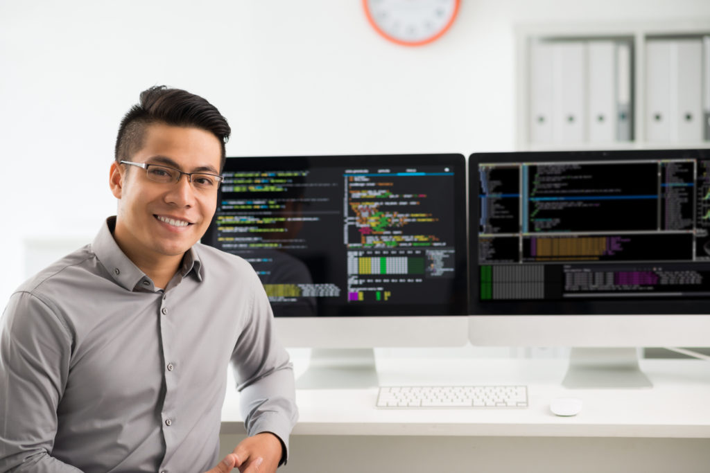 Portrait of a young Vietnamese software engineer smiling